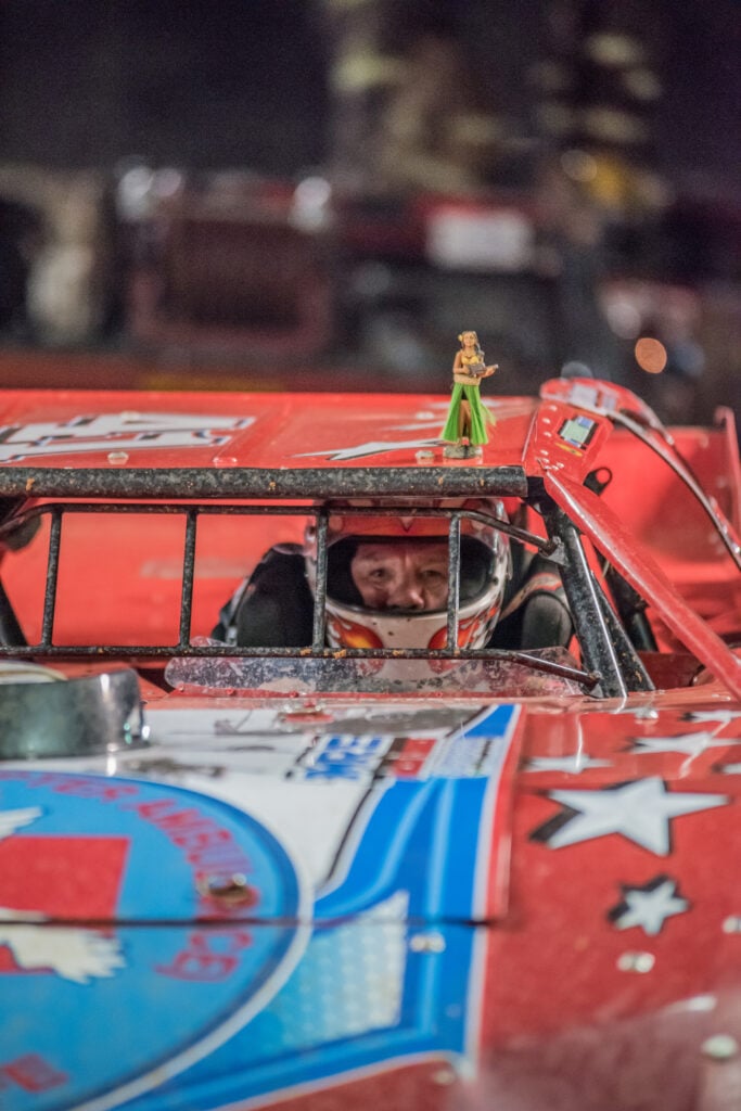 Race car with figurine on top